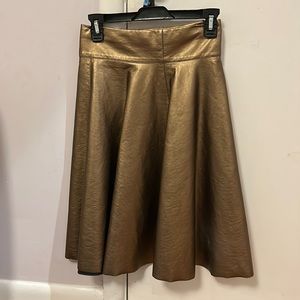 Knee length metallic gold skirt